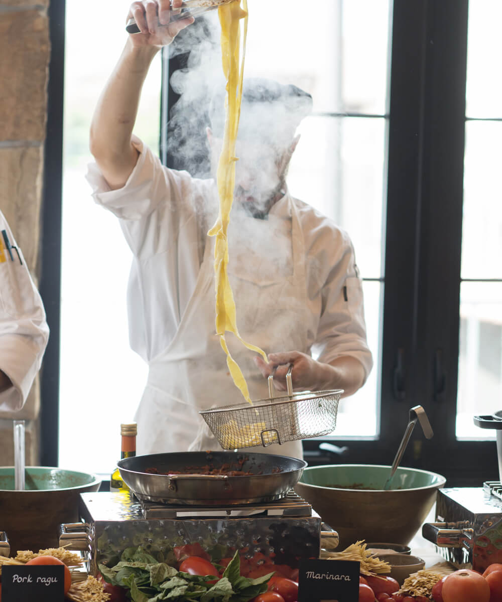 Chef making pasta - mobile version